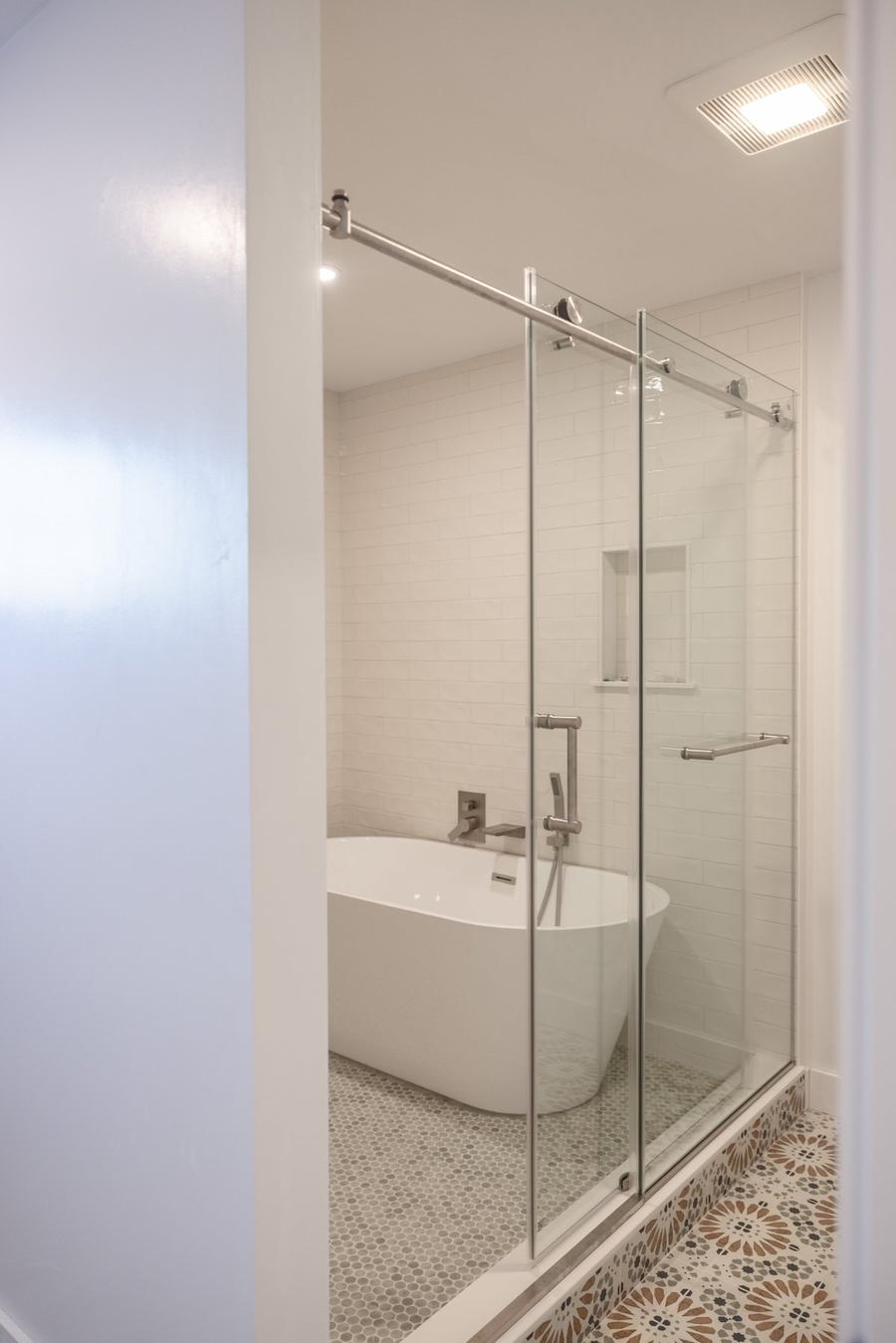 Modern bathroom remodel with freestanding tub, frameless glass shower and designer tile — Perocchi Building & Remodeling, South Shore MA