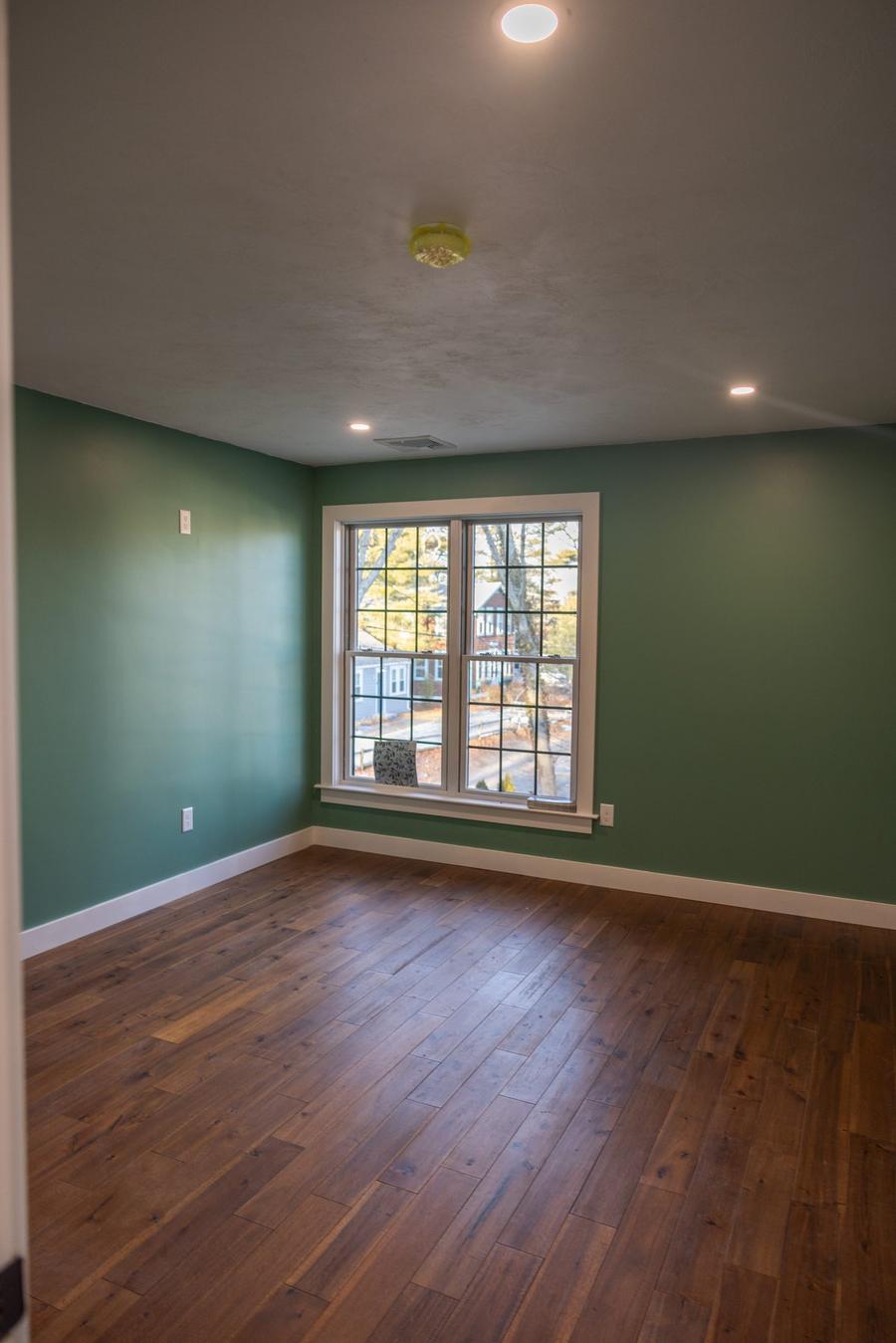 Master bedroom remodel with hardwood floors and large windows — Perocchi Building & Remodeling, Cape Cod MA