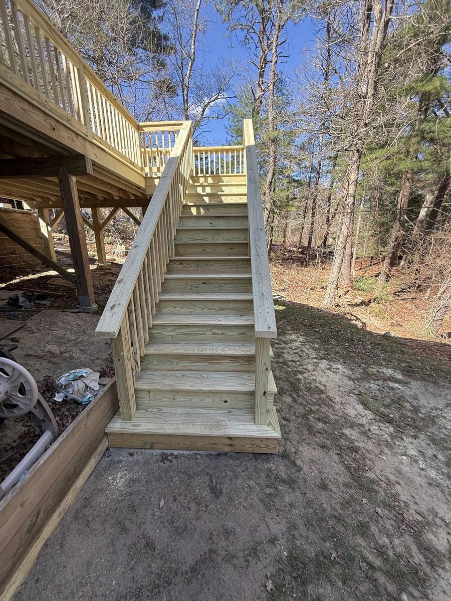 Detailed view of custom-built deck stairway craftsmanship by Perocchi Building & Remodeling, MA