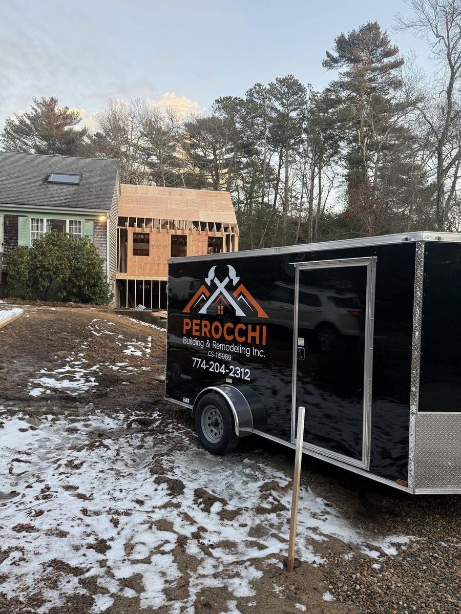 Perocchi Building & Remodeling branded jobsite trailer at an active new construction project in Plymouth, MA